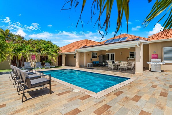 Cool off in our serene swimming pool, then lounge in comfort by the water's edge.