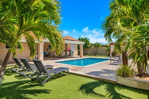 Escape to paradise: our inviting outdoor pool and sun lounges promise a refreshing retreat from the everyday.