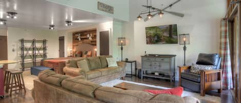 Living Room with Comfortable Furniture, Modern Mountain Decor, and Smart TV