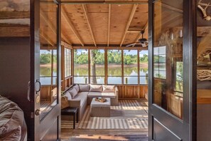 The living room opens to a large screened porch.