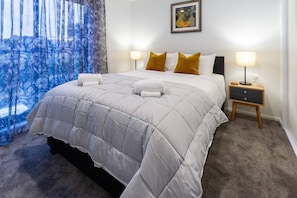 Spacious Bedroom - Hotel Quality Queen Bed, Soft Linen, Fluffy Pillows and Fresh Towels