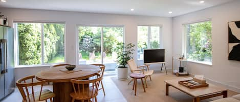 Living space featuring record player and frame tv