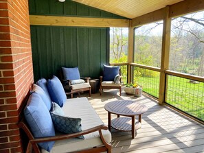 Relax on the new enlarged deck overlooking the river.