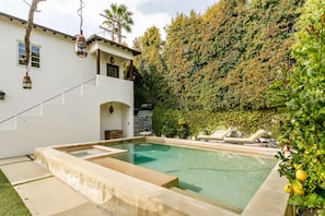 Pool, hot tub, chaise lounges with casita in background