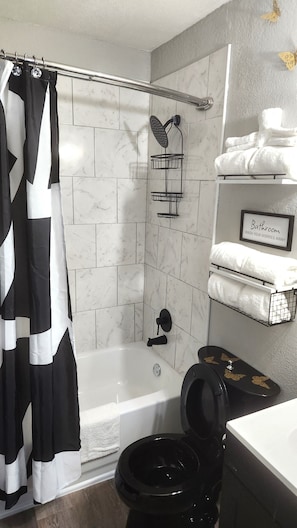 Bathroom with full tub and shower