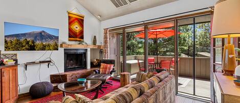 Living room with plenty of seating. Please note that the fireplace is non-functioning.