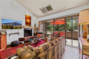 Living room with plenty of seating. Please note that the fireplace is non-functioning.