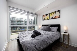 Bedroom featuring a Queen size bed and an ensuite bathroom