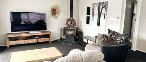 Living Room with large curved TV