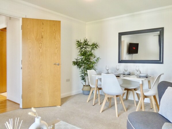 Gather around our cozy small dining table, ideal for enjoying meals and creating lasting memories in a warm atmosphere.
