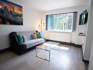 The living room is inviting and well-lit