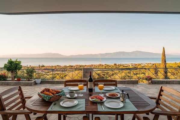 Seaview from the house – Elevated outdoor lounge with wide blue views

