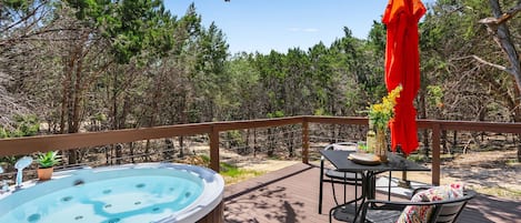 Outdoor jetted bathtub on the deck. Hill country views in the daytime and stargazing at night.