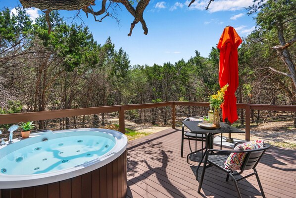 Outdoor jetted bathtub on the deck. Hill country views in the daytime and stargazing at night.