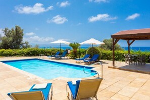 Private pool, terrace, and garden with sea views