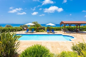 Private pool, terrace, and garden with sea views