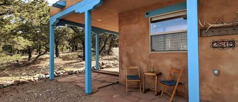 The front of the house, with wrap-around flagstone patio