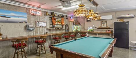 Amazing game room with pool table, darts, video games, and great seating.