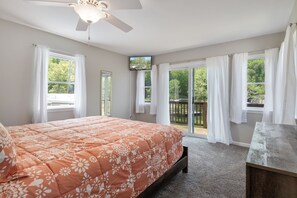 Wake up refreshed with the stunning view in this serene bedroom.