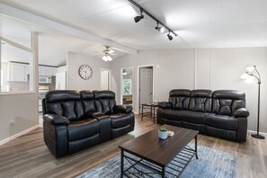 Perfect blend of comfort and style awaits in this spacious living room.