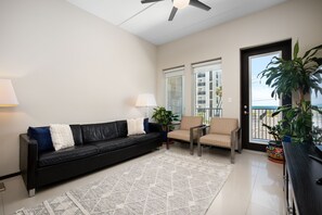 Living area with views to the ocean and direct balcony access