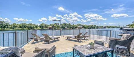 Upper dock with lounge chairs and seating area