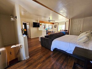 The upstairs queen daybed and tv mount create stadium seating.