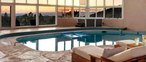 Luxury indoor pool with sweeping sunset views! This cold-water pool is typically 70-75°F in summer & a chilly 55°F in winter, ideal for cold plunges. Kindly note that water temperatures cannot be guaranteed due to varying weather conditions.