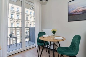 Dining area and access to balcony.