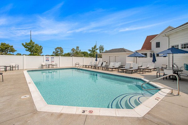Easy pool entry with poolside loungers.