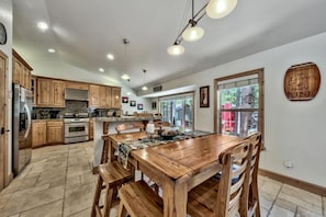 Adjacent to the living room is the casual dining area, breakfast bar, and fully-equipped kitchen.