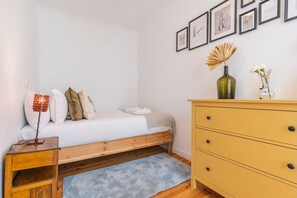 Bedroom 2 with a queen-sized bed and a cozy and harmonious decoration. #home #apartment #bedroom