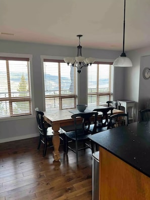 Table that sits 6 to 8 and 3 bar stools. 
In the Kitchen that is fully equipped.