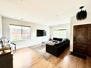 Huge Family Room with 70" SMART TV and hard floors throughout home