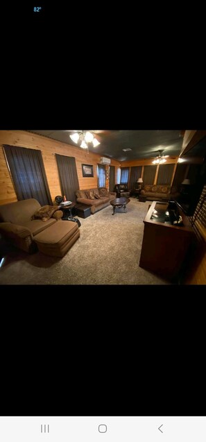 Living room. You may open the curtains to take in the view too! 