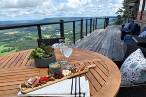 Unwind on the deck with a stunning mountain view and a charcuterie board perfect for sharing. The ultimate spot to relax and savor the moment.