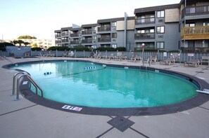 Take a cool dip in the sparkling pool after a fun day at the beach.