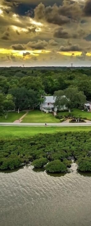 Drone view of the water and home