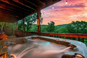 Relax in the hot tub, located on the lower deck