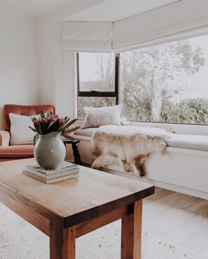 Relax and read a book in the sun looking out at the farm views.