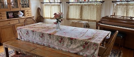 Large dining room with farm table perfect for meals, play and socializing