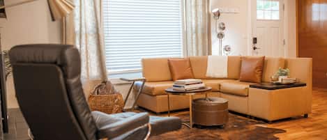 Elegant warmth meets timeless charm, a classic wood-accented living room designed for comfort and sophistication.
