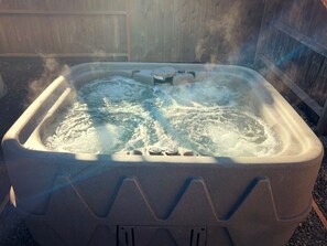 Relax in the private hot tub 