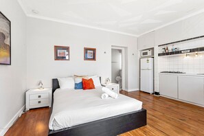 Unwind in this cozy queen bed, featuring a comfortable bed and plush linens.