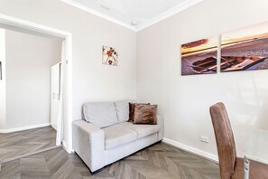 Relax and unwind in this cozy living area, perfect for kicking back and enjoying a quiet evening.