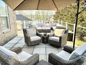 Have a sunset party on the deck with 4 padded chairs with umbrella, sectional sofa, two picnic tables with umbrellas and a propane grill. 