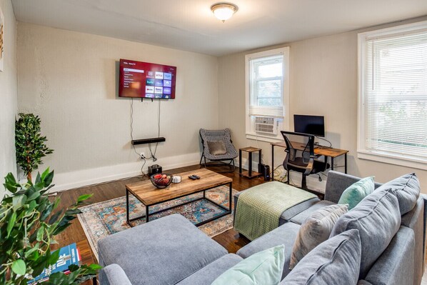 Living Room with TV, Sound Bar, Computer Monitor