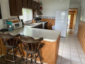 Full Kitchen with electric stove.