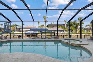 Heated saltwater pool with spa with plenty of lounging space