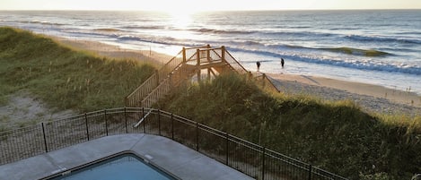 Oceanfront pool and private beach access.